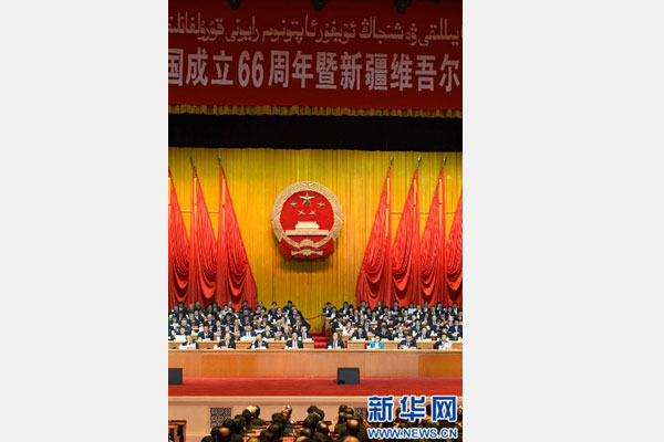 10月1日，慶祝中華人民共和國成立66周年暨新疆維吾爾自治區成立60周年大會在新疆人民會堂隆重舉行。 新華社記者 高潔 攝 