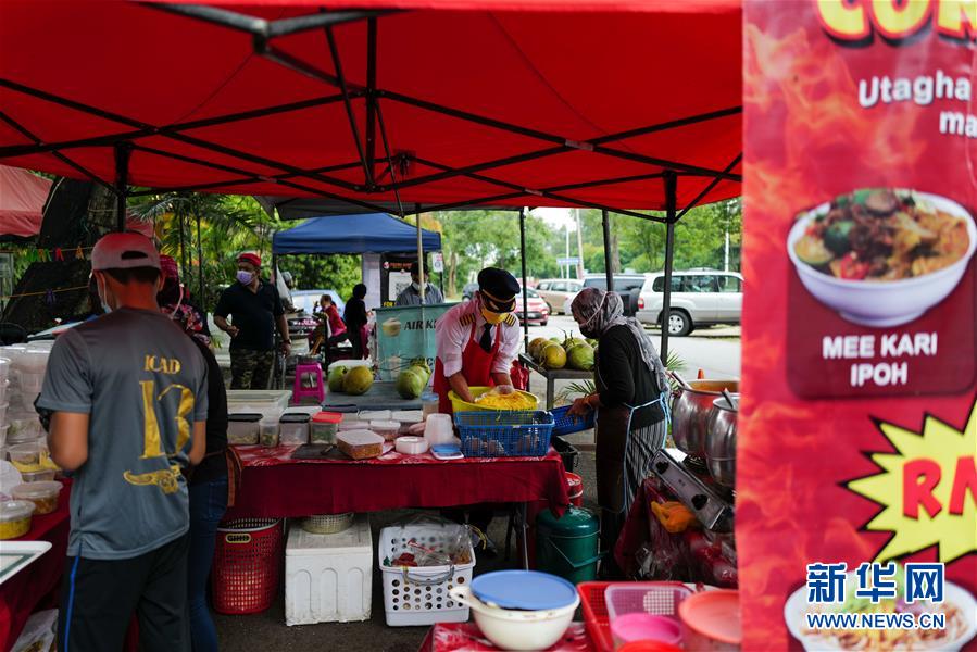 （國際&middot;圖文互動）（5）通訊：前方總有機遇&mdash;&mdash;記馬來西亞一位飛行員疫情下擺攤再就業(yè)